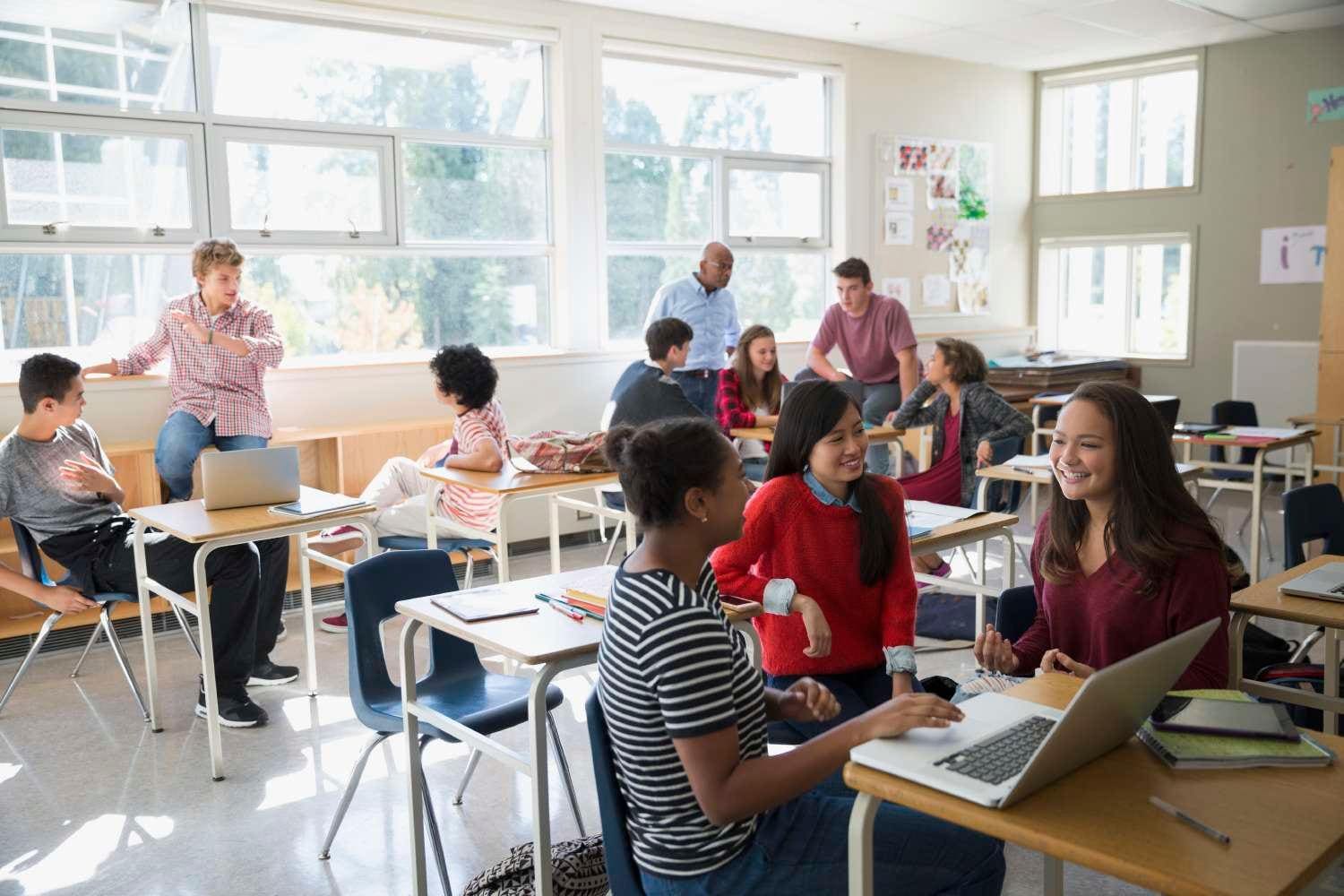 Students in classroom smiling