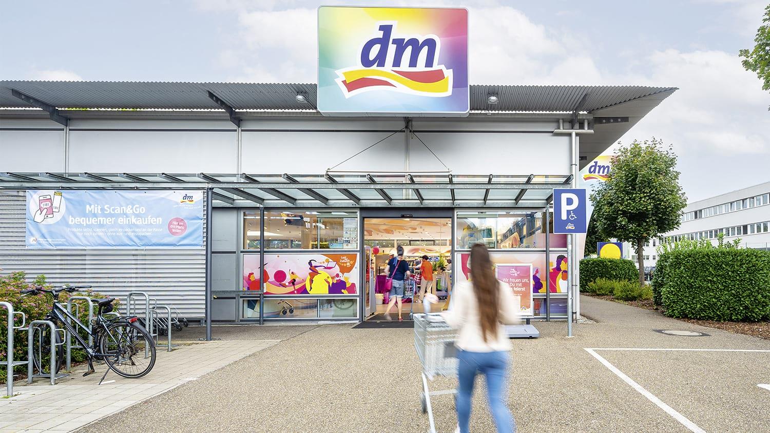 dm storefront with people going shopping