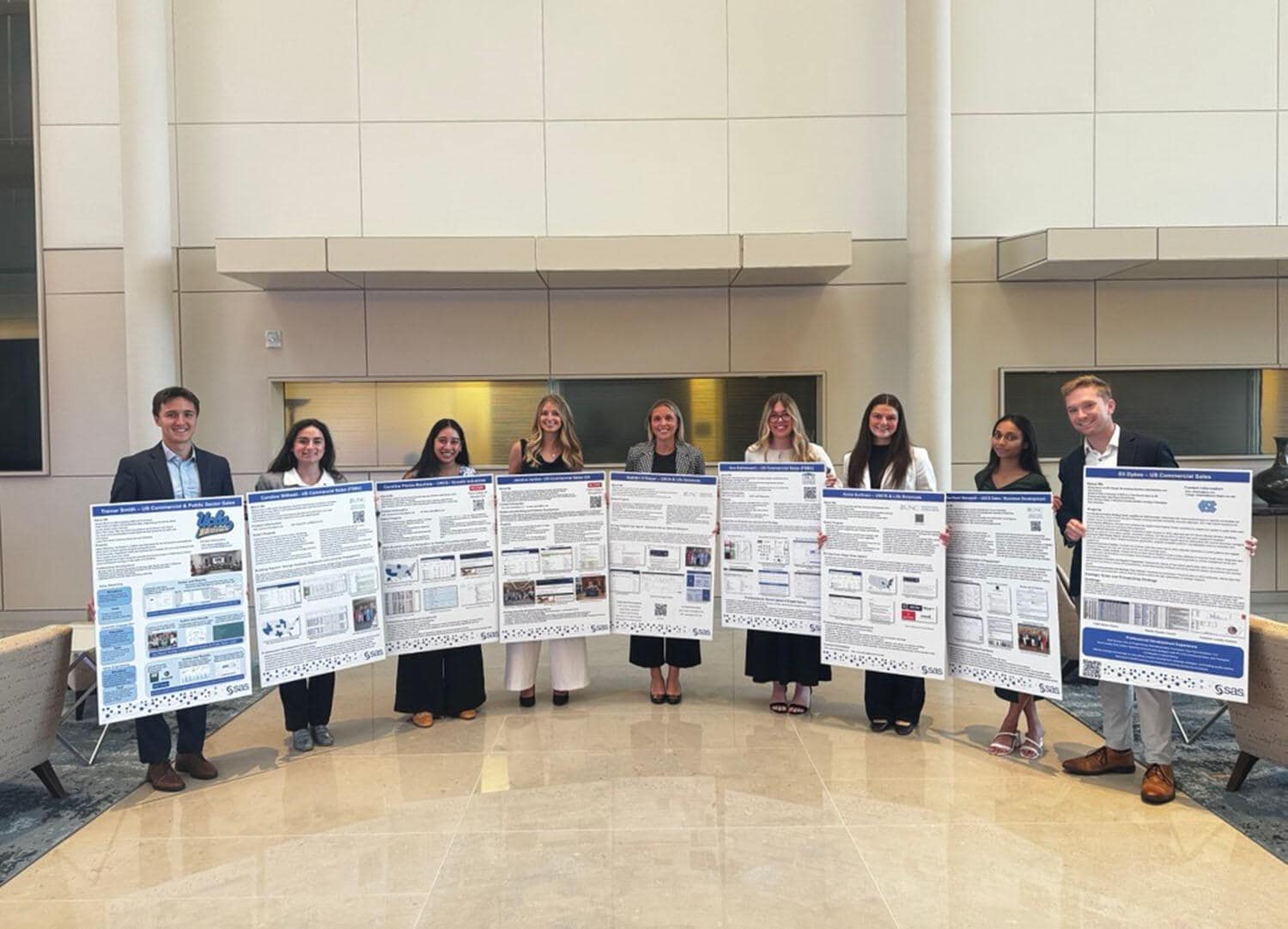 Group of interns holding their posters at Intern Expo